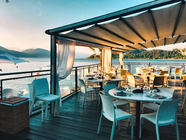The covered patio over the water on a clear afternoon